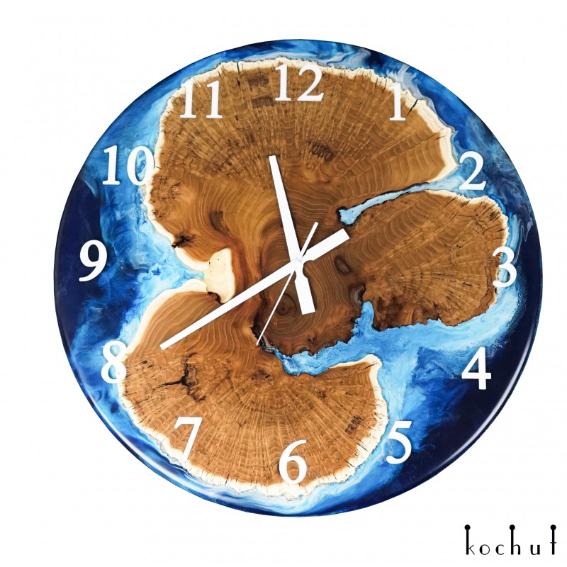 Wall clock «Tasmania». Wild olive, blue opaque epoxy resin, polyurethane varnish, round shape 